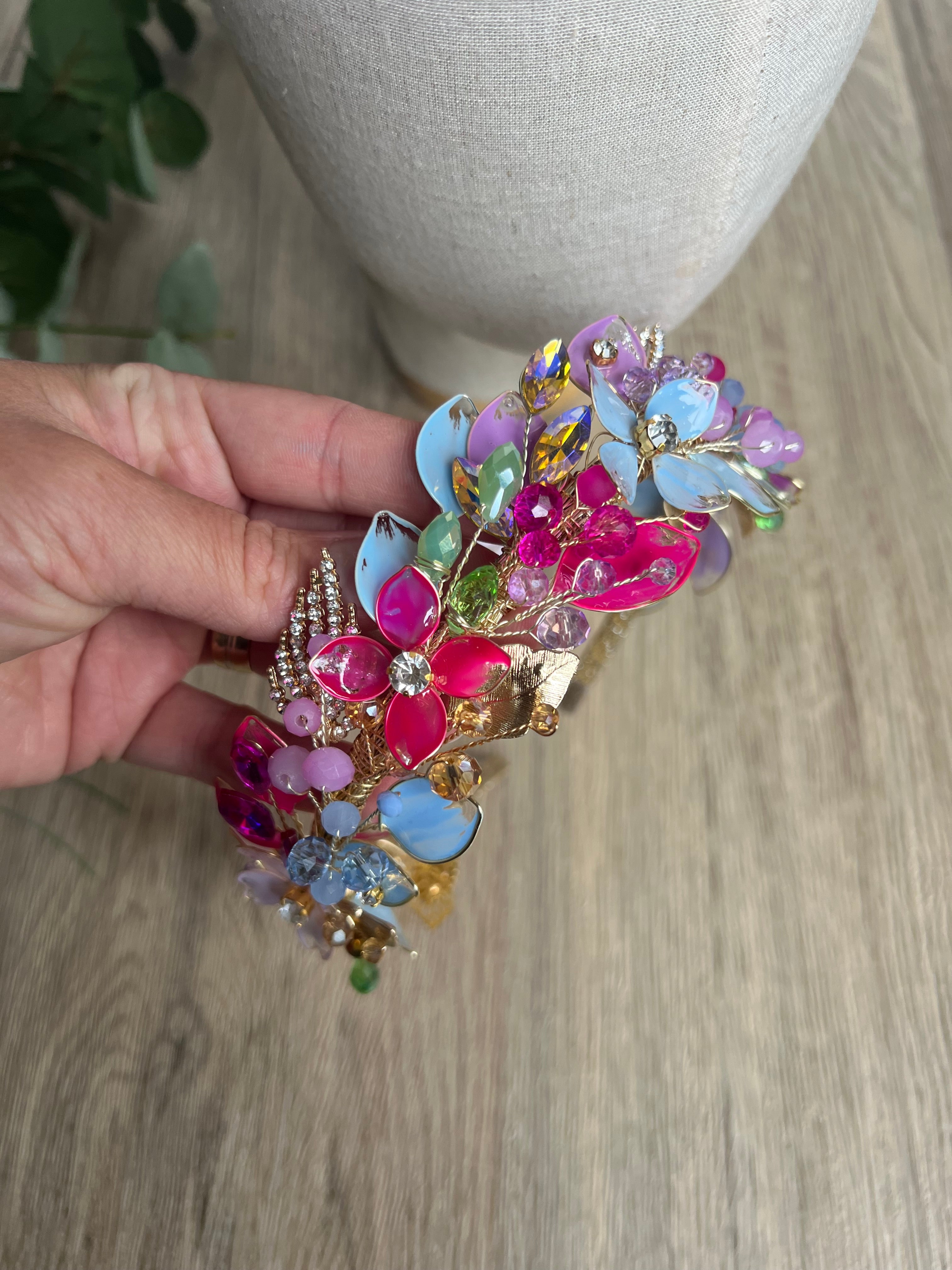 Lilac, blue and Fucshia detail low style headpiece Lilac, blue and Fucshia detail low style headpiece Precius pearls